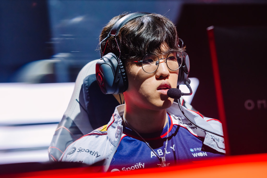 T1 jungler Oner on stage wearing a headset at MSI 2026